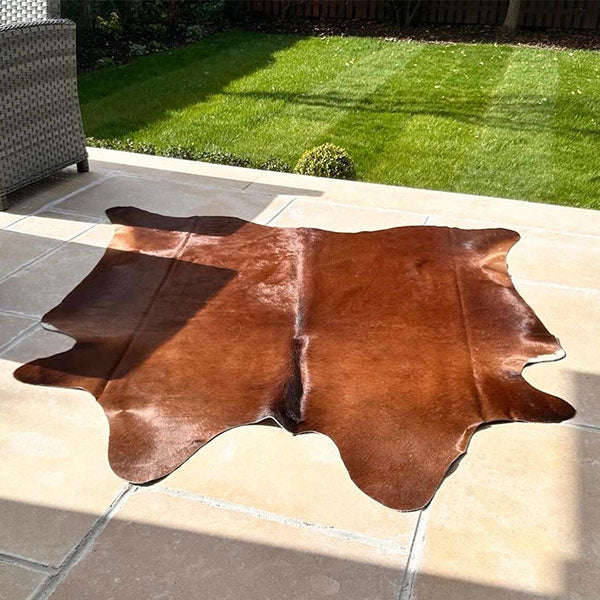 red cowhide rug