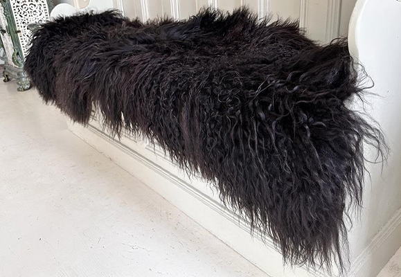 black shaggy sheepskin rug