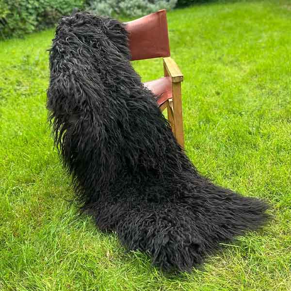 black runner rug made from sheepskin
