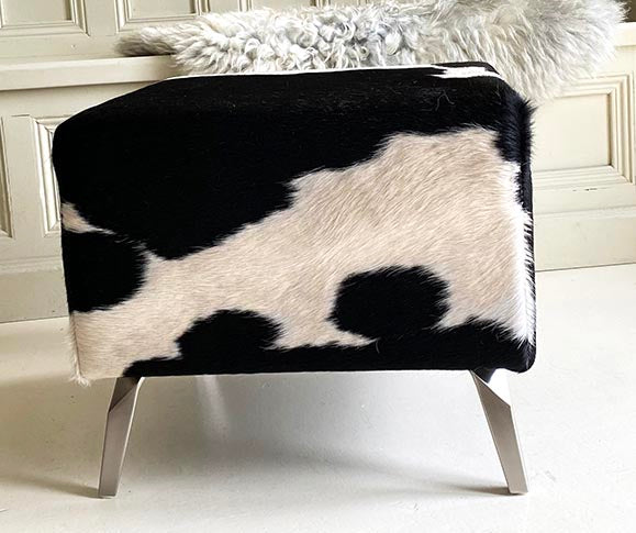black and white cowhide footstool