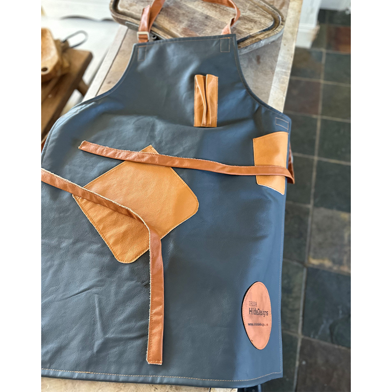 dark grey and tan leather apron