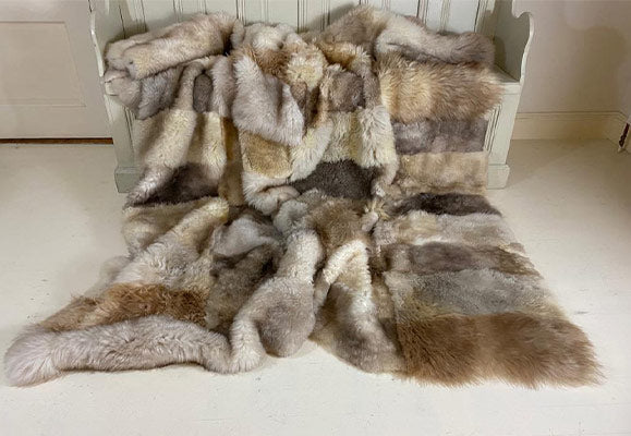 chequered beige lambskin throw