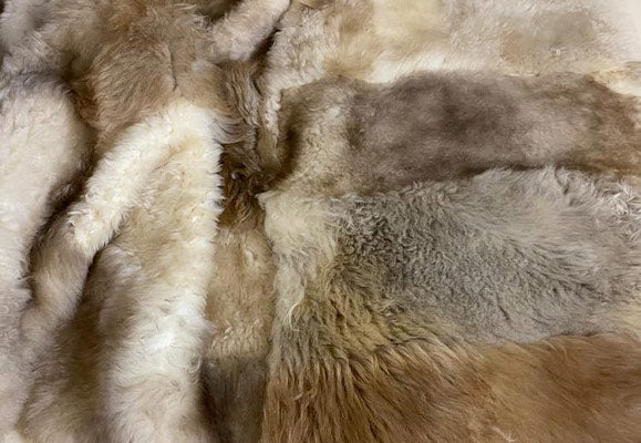 chequered beige lambskin throw