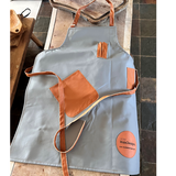 grey and tan leather apron