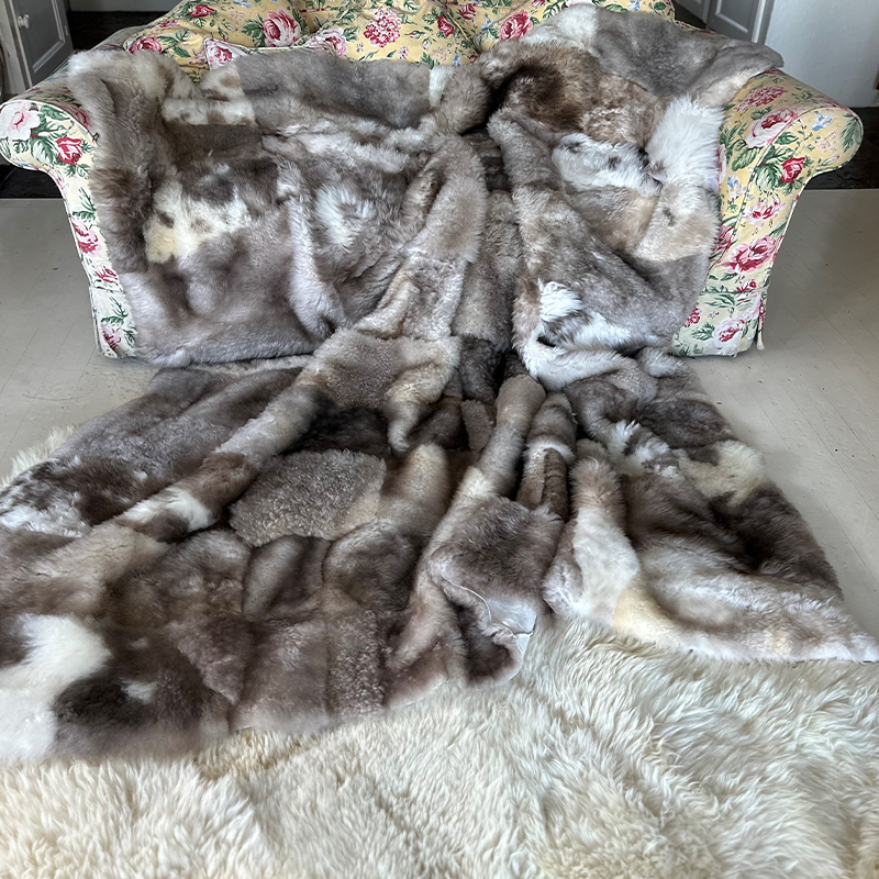 grey and beige lambskin throw