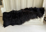 black shaggy sheepskin rug