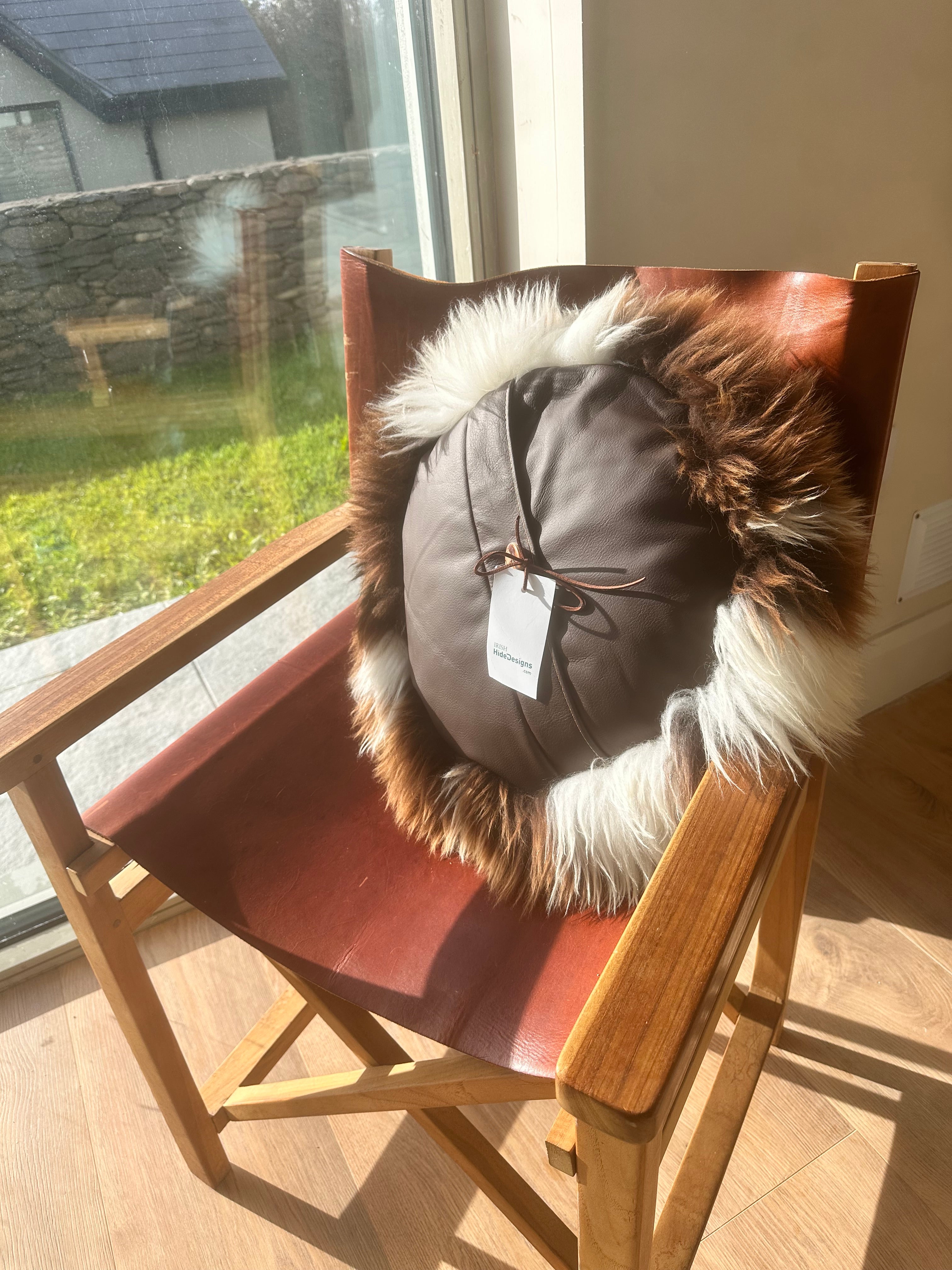 Round spotted sheepskin cushion