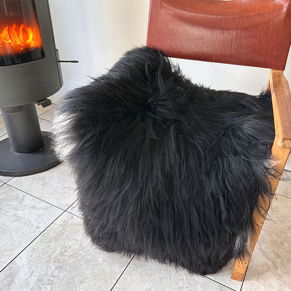 black sheepskin rug