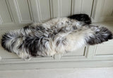brown and white sheepskin rug