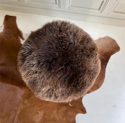 brown sheepskin footstool