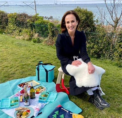 Lorraine Keane with sheepskin rug