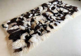 brown and white sheepskin rug