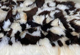 brown and white sheepskin rug