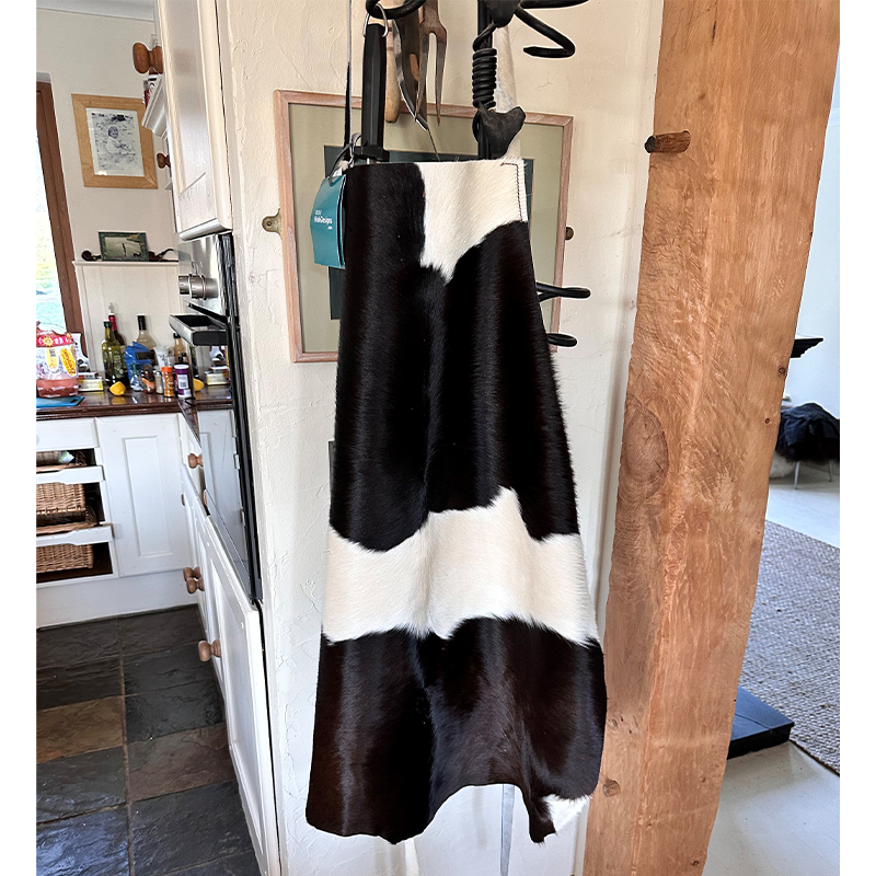 black and white cowhide apron