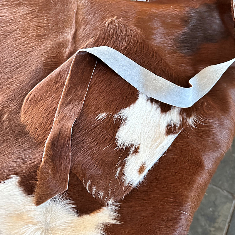 red and white cowhide apron