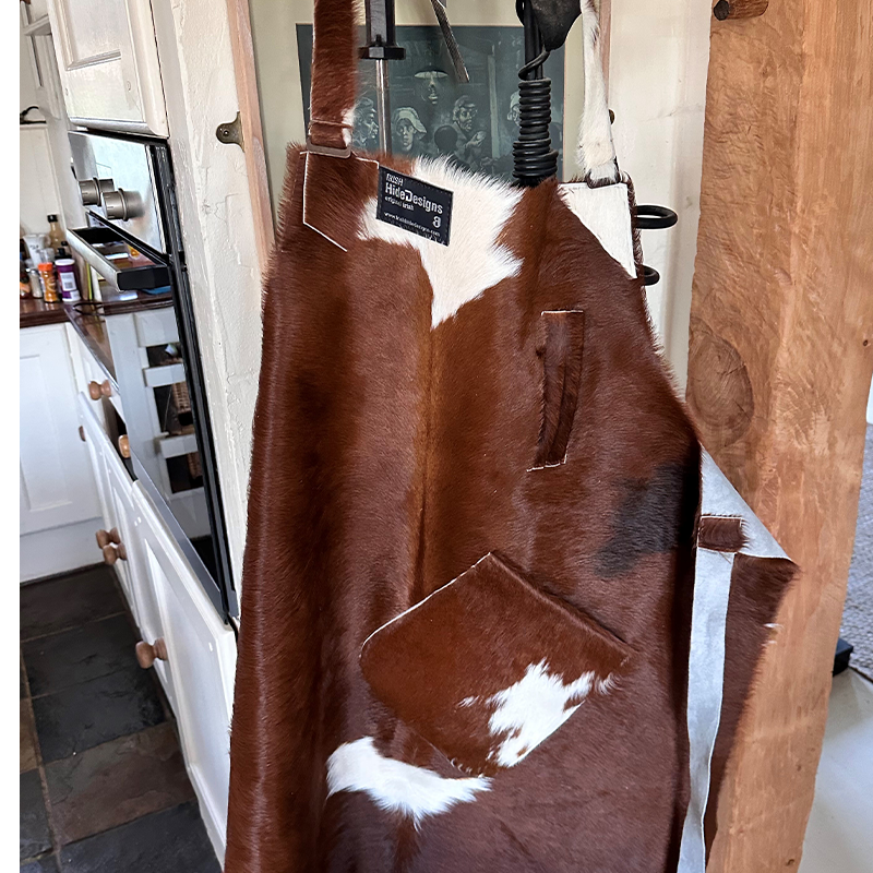 red and white calf skin apron