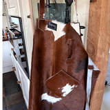 red and white calf skin apron