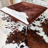 red and white cowhide ottoman