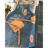dark grey and tan leather apron