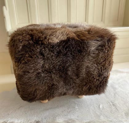 brown sheepskin footstool