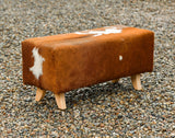 cowhide ottoman side view