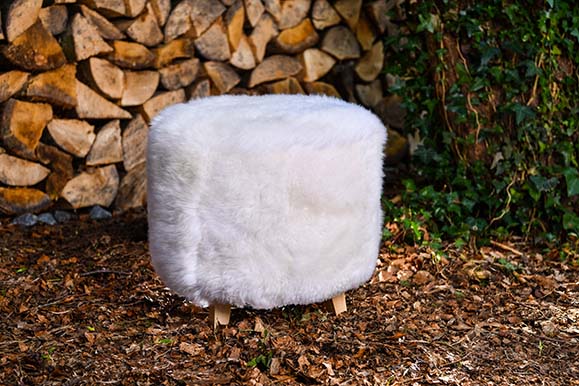 round white sheepskin footstool