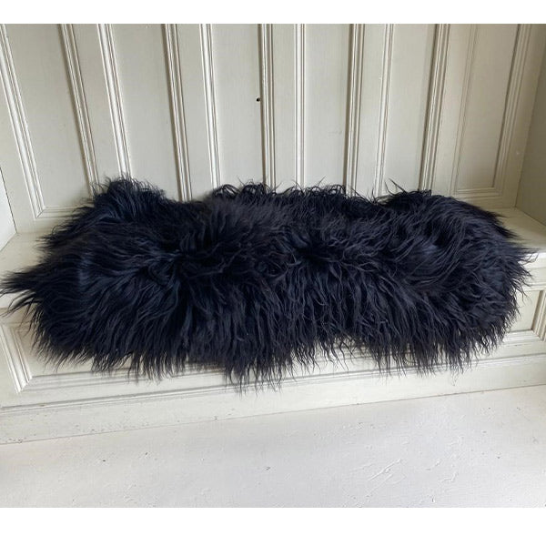 shaggy black sheepskin rug